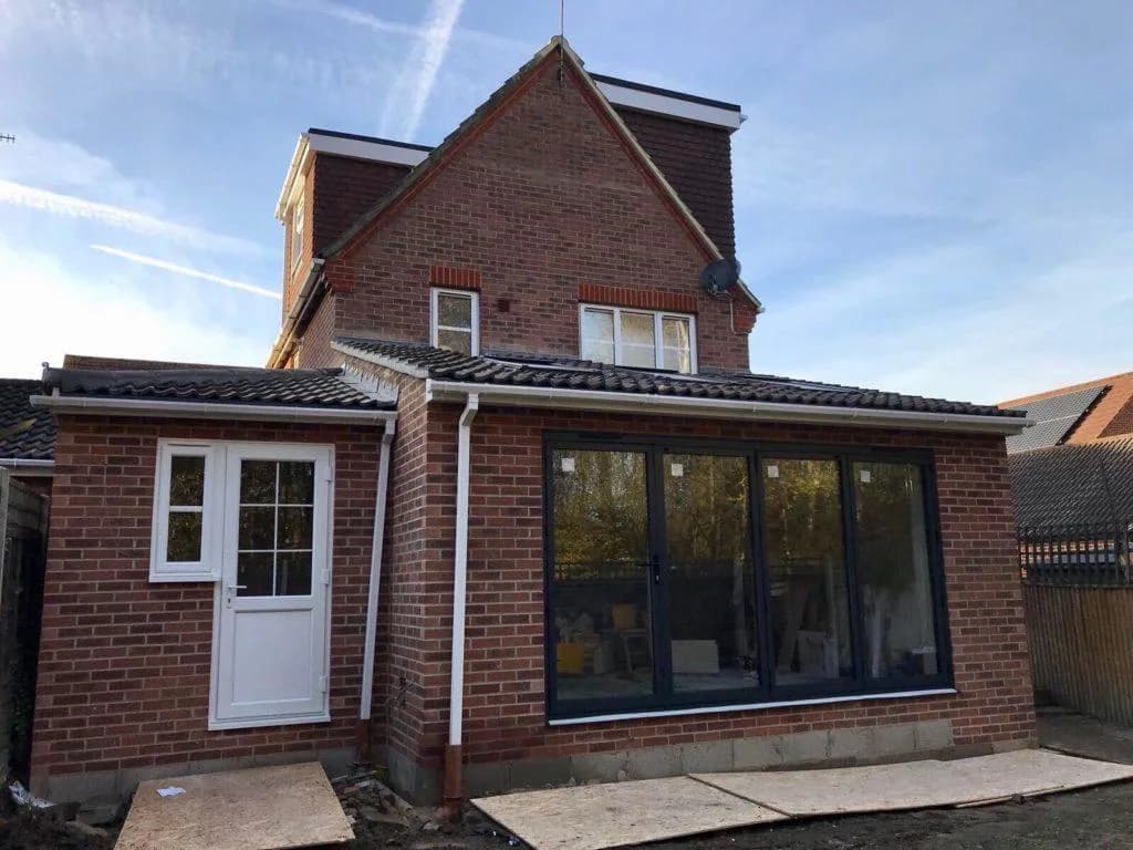 Single-storey rear extension built in brick with bi-fold doors