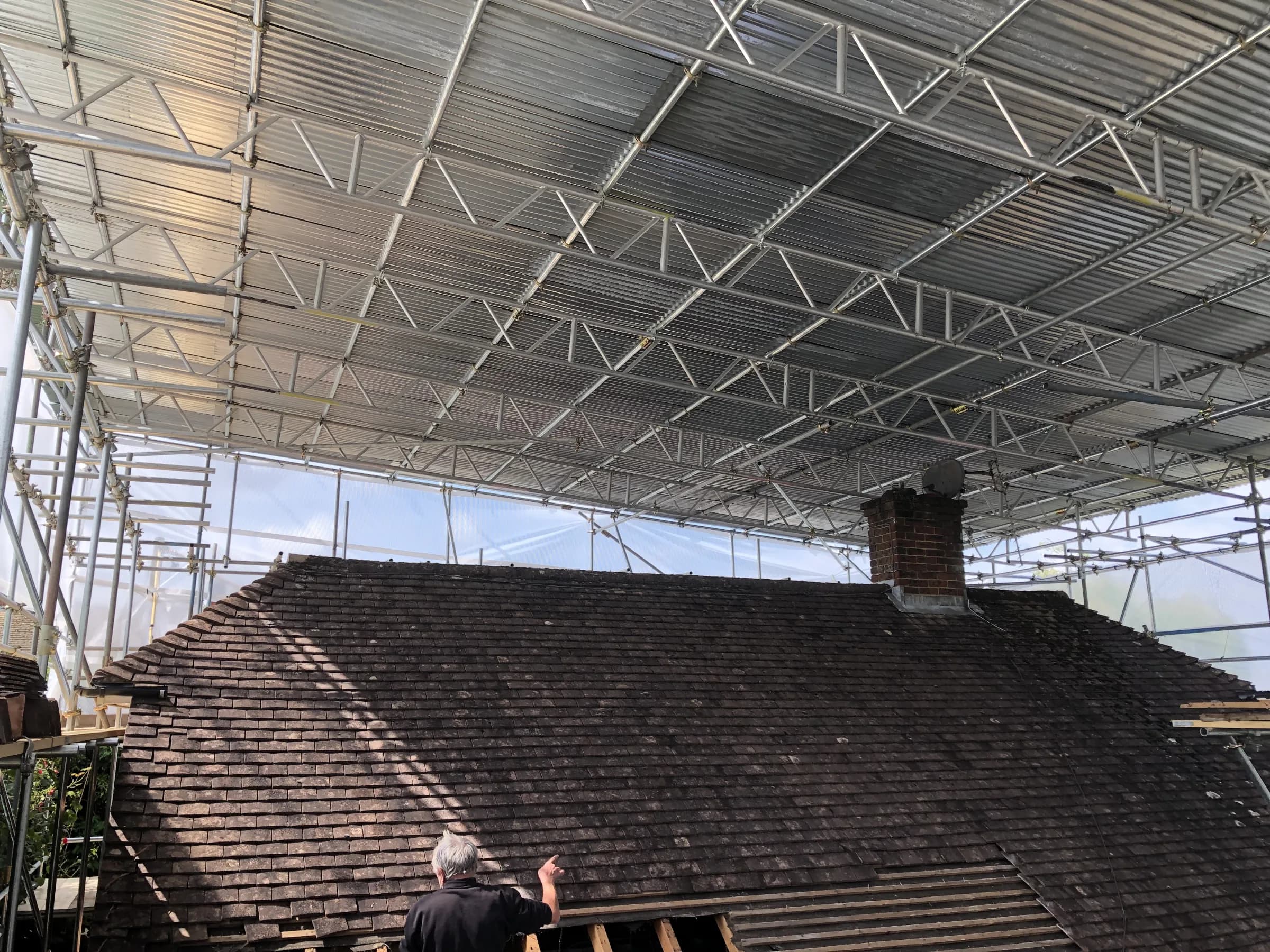 New roof structure and stud walls built under a temporary roof, photo 3